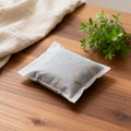 Natural bamboo charcoal air purifier on wooden table with plants