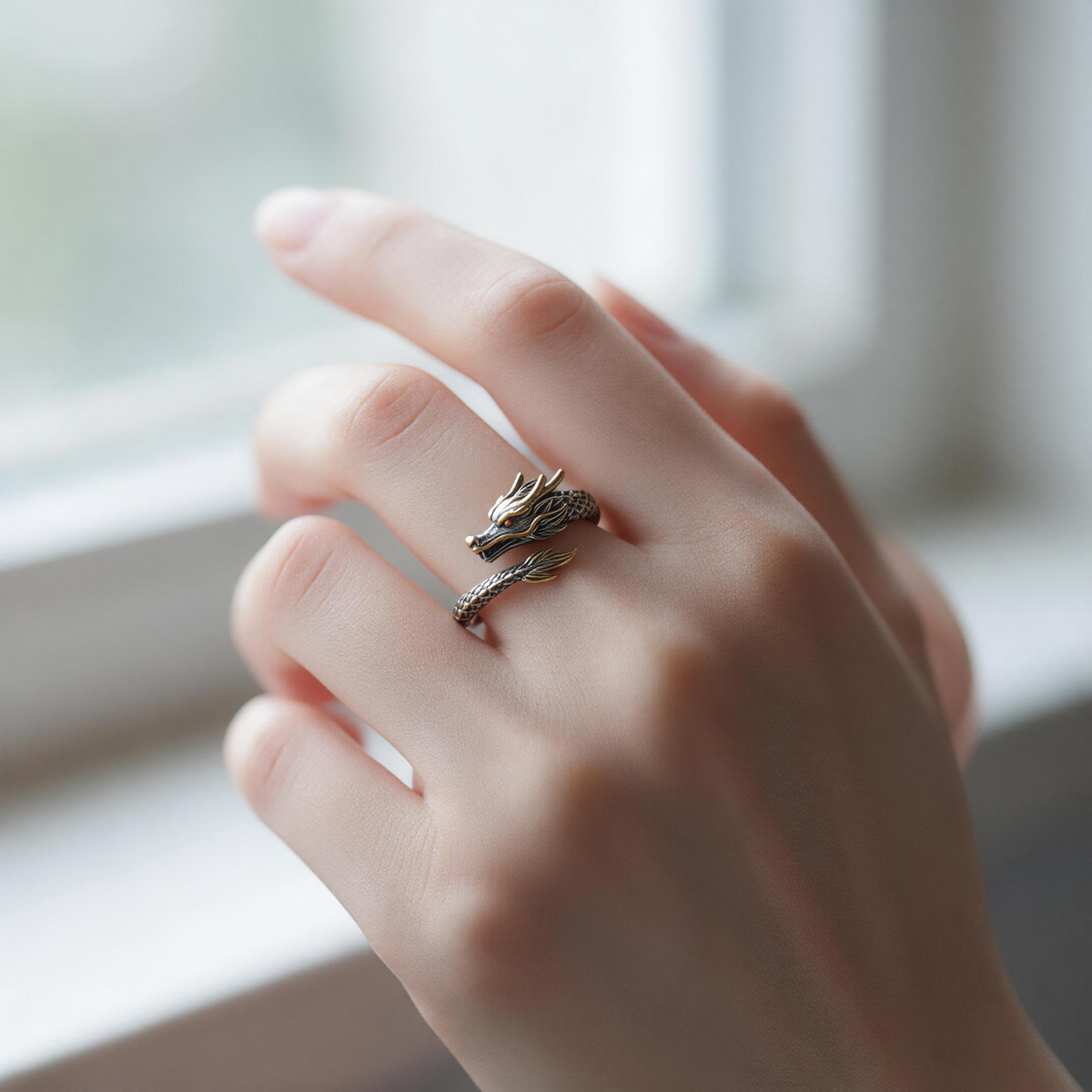 Hand wearing handmade Chinese zodiac ring, close-up of finger