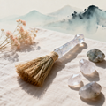 Handmade crystal cleansing broom with crystal handle on linen