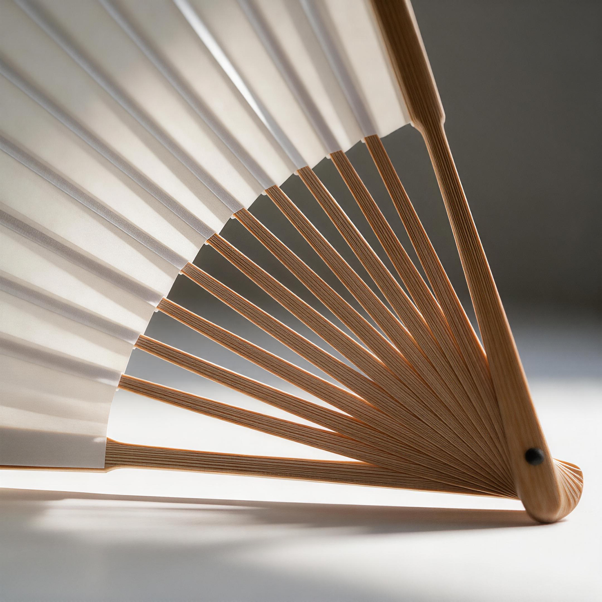 Close-up of bamboo fan ribs and rice paper surface